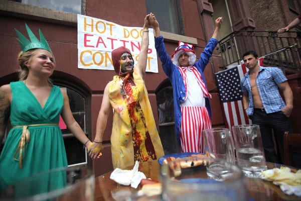 Buttsacker pummels Tiny in Hot Dog Eating Contest