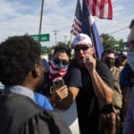 Protesters clash outside Colonie cupcake shop