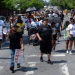 Community members march to demand an end to shootings in Albany